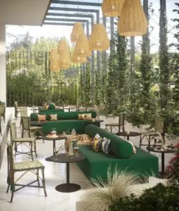 large bench for outdoor seating with additional French Bistro chairs