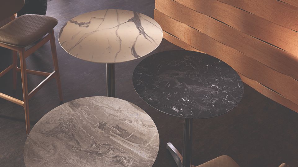 three granite custom table tops in a bar