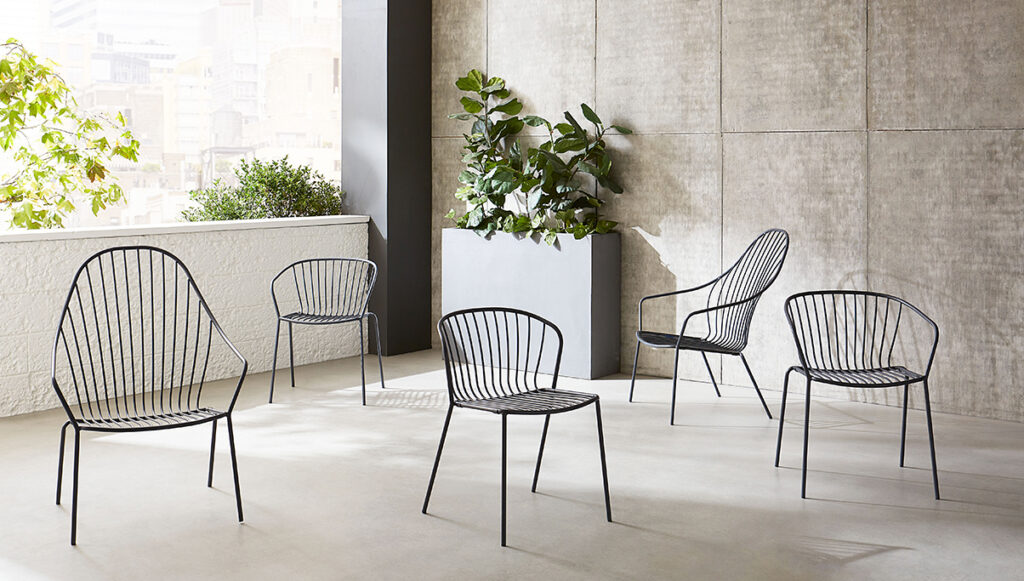various styles of outdoor chairs scattered in an open air room