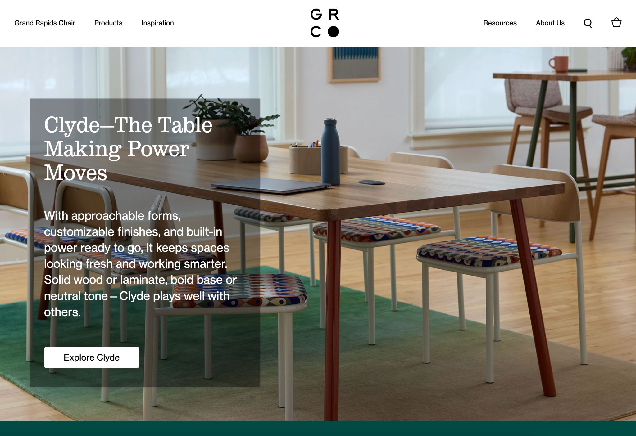 Grand Rapids Chair Co. website showcasing 'Clyde - The Table Making Power Moves' with various dining furniture in a modern setting.